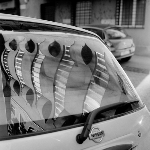 Reflection of Art Deco building in car window, Budapest